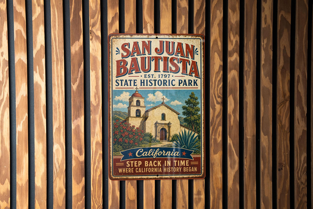 A vintage metal sign for San Juan Bautista State Historic Park, featuring a church and a sign that says "Step back in time where California history began".