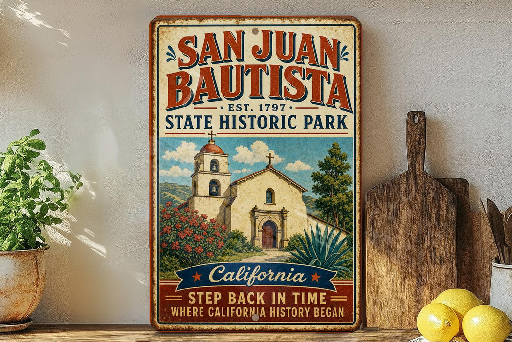 A vintage-style metal sign for San Juan Bautista State Historic Park, featuring an illustration of the historic mission church and the surrounding landscape.