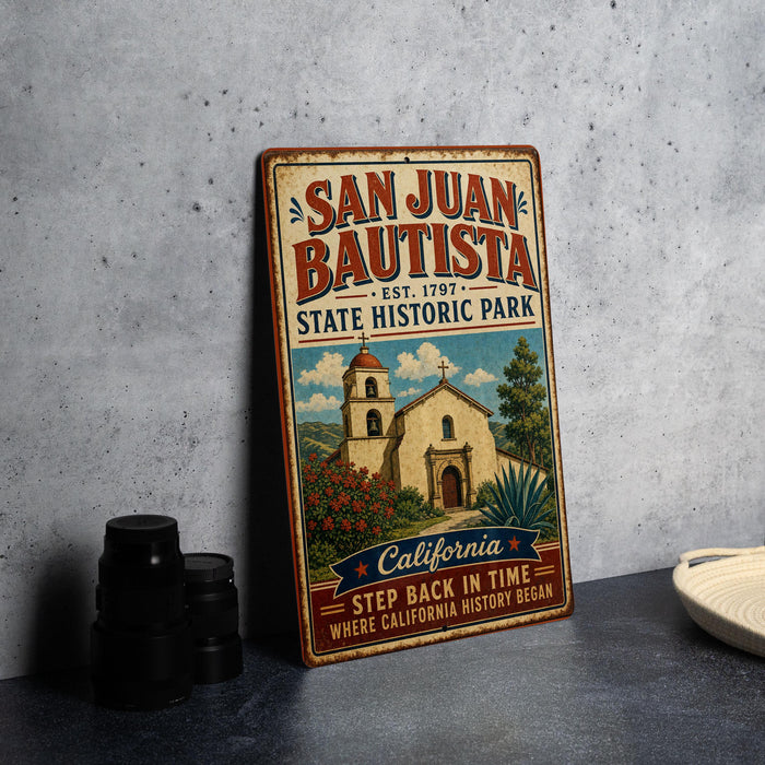 A vintage-style metal sign for San Juan Bautista State Historic Park, featuring an illustration of the historic Mission San Juan Bautista.