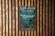 A metal sign with the text "SAN JUAN ISLANDS MARINE PRESERVE WASHINGTON" is displayed on a wooden wall.