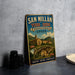 A vintage metal sign advertising San Millán monastery in Spain, featuring a scenic illustration of the monastery and surrounding landscape.