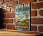 A vintage-style metal sign for Santa Ana National Wildlife Refuge in Texas, featuring an illustration of a pink flamingo and various wildlife elements.