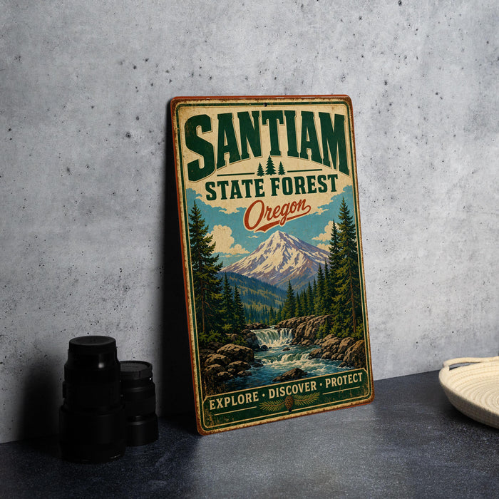 A vintage-style metal sign for Santiam State Forest in Oregon, featuring a scenic mountain landscape with a waterfall.