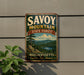 A vintage metal sign for Savoy Mountain State Forest in Massachusetts, featuring a scenic landscape with pine trees, a lake, and mountains.