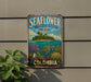 A vintage metal sign for the Seaflower Bioscape Reserve in Colombia, featuring a tropical island, sea turtle, and various marine life.