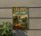 A vintage metal sign advertising the Selous Game Reserve in Tanzania, featuring an illustration of an elephant and a crocodile in a natural setting.