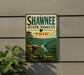A vintage metal sign for Shawnee State Forest, Ohio, featuring a scenic landscape with a river and mountains.
