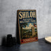 A vintage metal sign for Shiloh National Military Park in Tennessee, featuring a cannon and a monument, is displayed on a gray countertop.