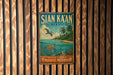 A vintage metal sign with the text "SIAN KÁAN MEXICO" and an illustration of a tropical beach scene with palm trees and a bird in flight.
