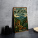 A vintage-style metal sign with a leopard and tropical foliage, advertising the Sierra de Manantlan reserve in Mexico.