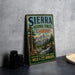 A vintage-style sign for Sierra National Forest, California, featuring a scenic mountain landscape with a river and pine trees.