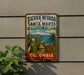 A vintage-style sign for Sierra Nevada de Santa Marta Biosphere Reserve in Colombia, featuring a tropical landscape with a bird, palm trees, and mountains.