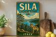 A vintage-style metal sign for the Sila Biosphere Reserve in Italy, featuring a wolf in a forest setting.