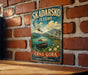 A vintage-style metal sign with the text "Skadarsko Jezeroo" and "Carna Gora" hangs on a brick wall.