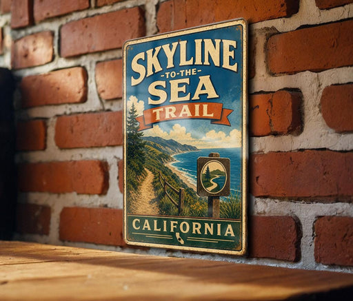 A vintage-style metal sign with the text "SKYLINE TO THE SEA TRAIL" and "CALIFORNIA" is displayed on a brick wall.