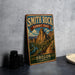 A vintage-style metal sign for the Smith Rock Summit Trail in Oregon, featuring a scenic mountain landscape with a winding trail.