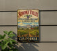 A vintage-style sign for Sonoma Valley, California, featuring a vineyard landscape and the text "Sonoma Valley Viticultural Heritage Landscape" and "California".