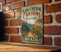 A vintage-style metal sign for Southern Canyons Pathways Park in Brazil, featuring a scenic illustration of the park's natural landscape.