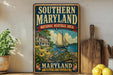 A vintage-style metal sign for the Southern Maryland National Heritage Area, featuring a sailboat, flowers, and a house, is displayed on a shelf next to a wooden cutting board and some lemons.