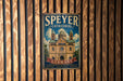 A vintage metal sign for Speyer Cathedral in Germany, featuring an illustration of the cathedral and the text "Speyer Cathedral" prominently displayed.