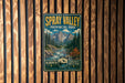 A vintage-style metal sign for Spray Valley Provincial Park in Alberta, Canada, featuring a scenic mountain landscape with a river and pine trees.