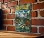 A vintage-style metal sign for Spray Valley Provincial Park in Alberta, Canada, featuring a scenic mountain landscape with a river and pine trees.