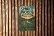 A vintage metal sign for Spruce Woods Provincial Park, Manitoba, featuring a scenic illustration of a deer in a forest setting.