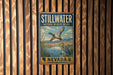 A vintage metal sign for the Stillwater National Wildlife Refuge in Nevada, featuring a bird illustration and the text "STILLWATER NATIONAL WILDLIFE REFUGE NEVADA".