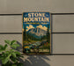 A vintage-style sign for Stone Mountain Provincial Park in British Columbia, Canada, featuring a mountain landscape with pine trees and a river.
