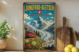 A vintage-style poster advertising Jungfrau-Aletsch, Switzerland, featuring a train traveling through a mountainous landscape with a Swiss flag.