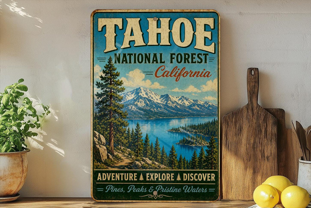 A vintage-style sign for the Tahoe National Forest in California, featuring a scenic mountain landscape with pine trees, a lake, and a wooden paddleboard.