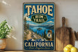 A vintage-style sign for the Tahoe Rim Trail in California, featuring a scenic mountain landscape with a lake and pine trees.