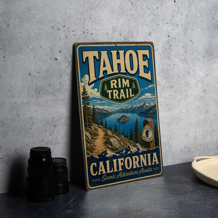 A vintage-style sign for the Tahoe Rim Trail in California, featuring a scenic mountain landscape and a trail marker.
