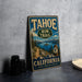 A vintage-style sign for the Tahoe Rim Trail in California, featuring a scenic mountain landscape and a trail marker.