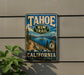 A vintage-style metal sign for the Tahoe Rim Trail in California, featuring a scenic mountain landscape with a lake and pine trees.