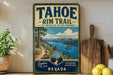 A vintage-style sign for the Tahoe Rim Trail in Nevada, featuring a scenic mountain landscape with a lake and pine trees.