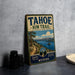 A vintage-style metal sign for the Tahoe Rim Trail in Nevada, featuring a scenic mountain landscape and a trail.