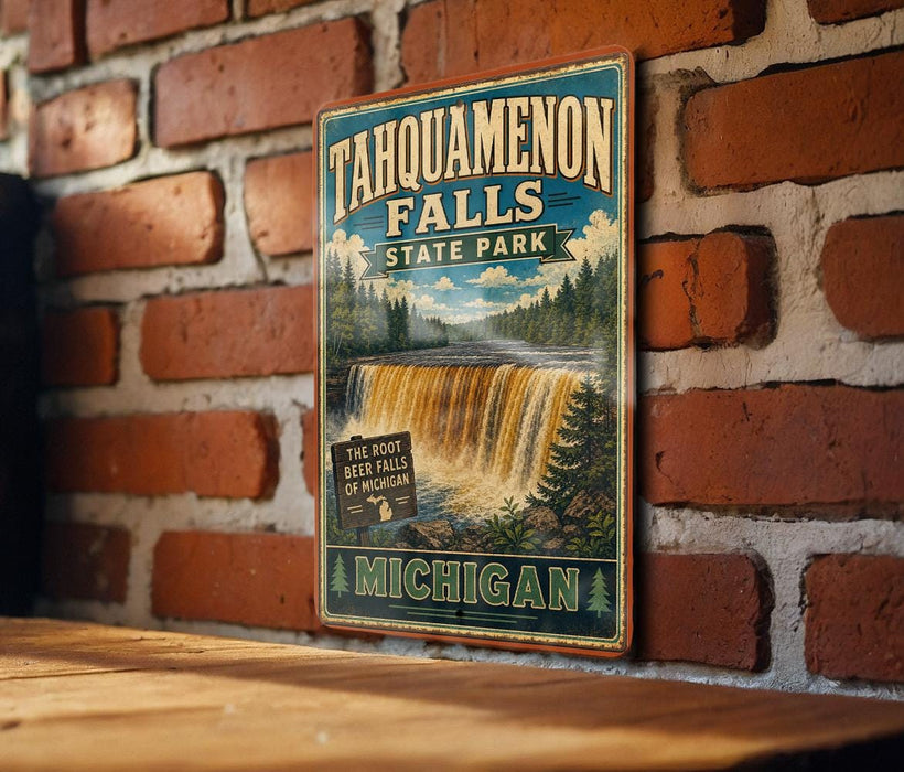 A vintage-style metal sign for Tahquamenon Falls State Park in Michigan, featuring a waterfall and forest scenery.