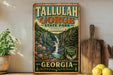 A vintage-style sign for Tallulah Gorge State Park in Georgia, featuring a scenic illustration of the waterfall and surrounding landscape.