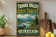 A vintage-style sign for Tanana Valley State Forest in Alaska, featuring a moose and a mountain landscape.