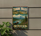 A vintage-style metal sign for Tanana Valley State Forest in Alaska, featuring a moose and a mountain landscape.