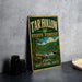 A vintage-style sign for the Tar Hollow State Forest in Ohio, featuring a scenic landscape with a waterfall and forest.