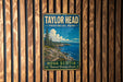A vintage metal sign for Taylor Head Provincial Park in Nova Scotia, featuring a scenic landscape with a rocky coastline and a pine tree.