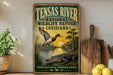 A vintage-style sign for the Tensas River National Wildlife Refuge in Louisiana, featuring an illustration of a duck and alligator in a natural setting.