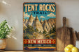 A vintage-style sign for the Tent Rocks Trail in New Mexico, featuring a scenic illustration of the rock formations.