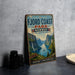 A vintage-style metal sign for "The Fjord Coast Park in Norway" is displayed on a gray wall, featuring a scenic image of a fjord surrounded by mountains and a waterfall.