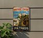 a vintage-style sign for the Historic Centre (Chora) in Greece, with a picture of a Greek island and a cave.