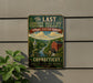 A vintage-style metal sign for "The Last Green Valley National Heritage Corridor" in Connecticut, featuring a scenic illustration of a river, buildings, and a church.