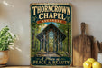 A vintage-style sign for the "Thorncrown Chapel" in Arkansas, featuring an illustration of the chapel's wooden structure surrounded by trees.