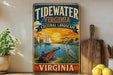 A vintage-style metal sign for Tidewater Virginia, featuring a seascape with a lighthouse, sailboat, and crane, along with the text "TIDEWATER VIRGINIA CULTURAL LANDSCAPE" and "VIRGINIA" at the bottom.